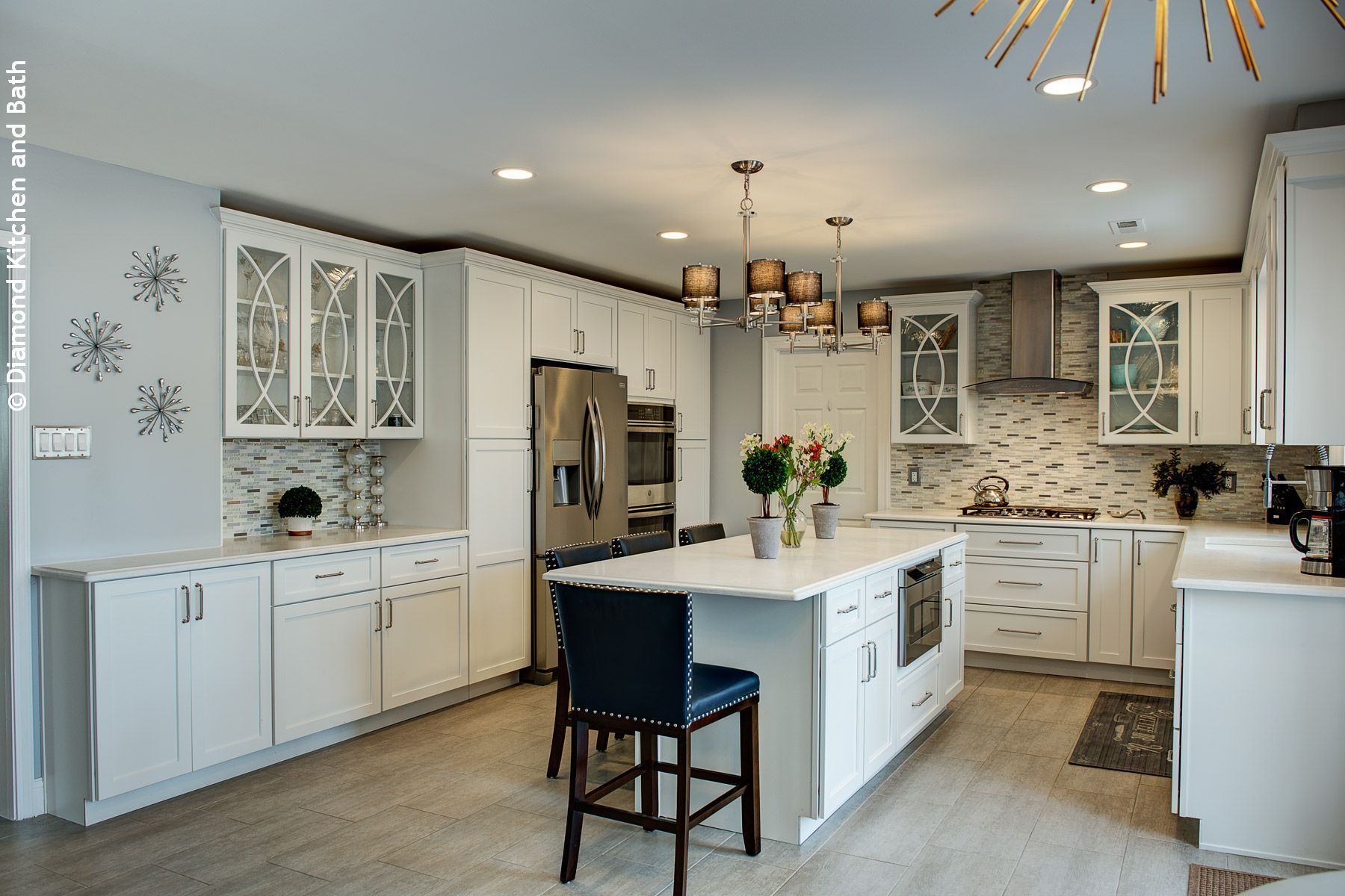 White kitchen remodel with glass-front cabinets and large island